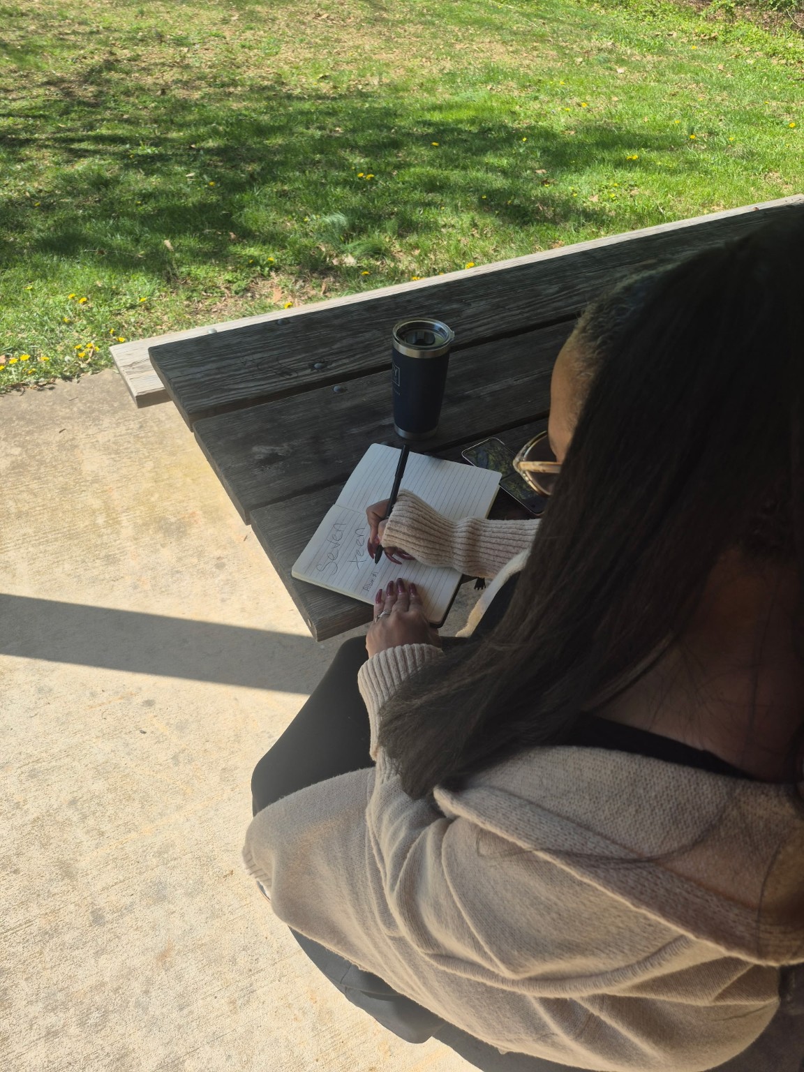 Taria’s pen and notebook during an outdoor writing moment